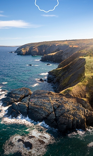 Waves are crashing against the coastline in Fortune Head.