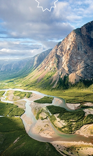 A river with many paths flows through the untouched landscape of the Torngat Mountains.